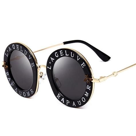 gucci round sunglasses with letters.